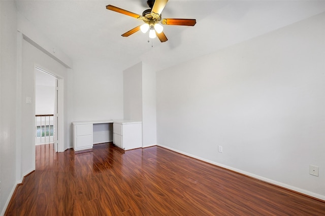 3606 Mira Glen Dr, Pearland, TX 77584 - spare room featuring dark wood-type flooring, baseboards, a ceiling fan, and vaulted ceiling