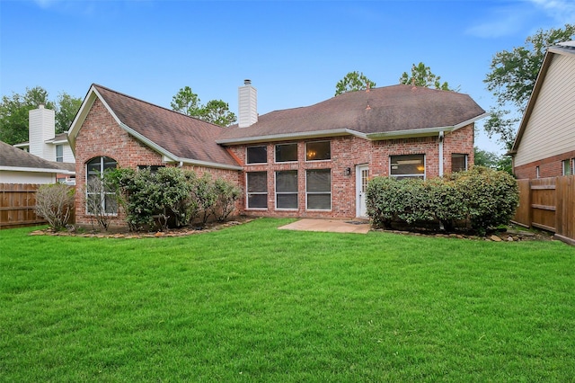 3606 Mira Glen Dr, Pearland, TX 77584 - rear view of property featuring brick siding, a shingled roof, and a chimney
