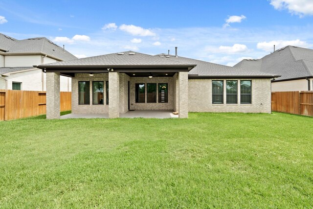27423 Parker Spring Ct, Katy, TX 77494 - back of property with ceiling fan, brick siding, a patio, and a shingled roof
