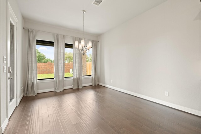 27423 Parker Spring Ct, Katy, TX 77494 - unfurnished dining area with a chandelier, dark wood-style floors, and baseboards