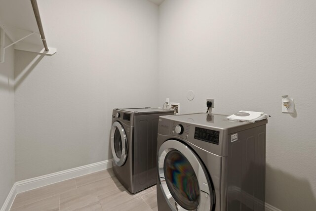 27423 Parker Spring Ct, Katy, TX 77494 - washroom with washer and dryer and baseboards
