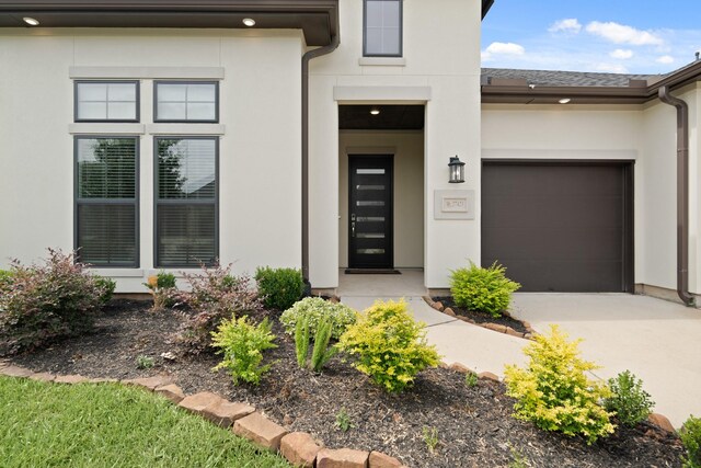 27423 Parker Spring Ct, Katy, TX 77494 - entrance to property with stucco siding, concrete driveway, and an attached garage