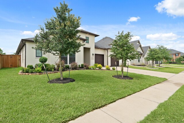 27423 Parker Spring Ct, Katy, TX 77494 - view of front of house with a garage, concrete driveway, and stucco siding