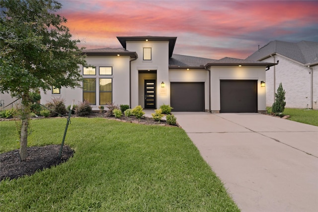 27423 Parker Spring Ct, Katy, TX 77494 - view of front of house with stucco siding, an attached garage, driveway, and a yard
