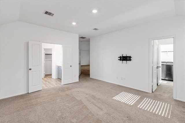 21219 Mangrove Ln, Cypress, TX 77433 - unfurnished bedroom with carpet flooring, a spacious closet, baseboards, vaulted ceiling, and recessed lighting