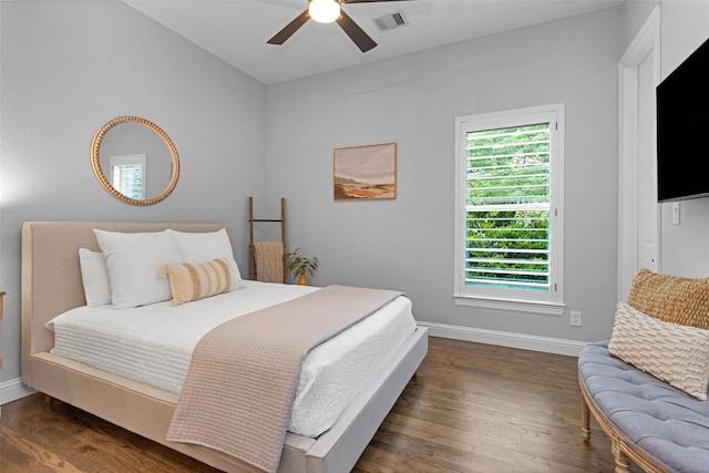 7 Woodglade Way, Tomball, TX 77375 - bedroom featuring baseboards, dark wood-type flooring, and a ceiling fan