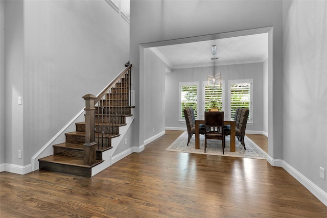 7 Woodglade Way, Tomball, TX 77375 - dining room featuring stairs, ornamental molding, a chandelier, wood finished floors, and baseboards