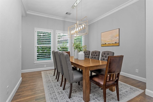 7 Woodglade Way, Tomball, TX 77375 - dining room featuring crown molding, a chandelier, wood finished floors, and baseboards