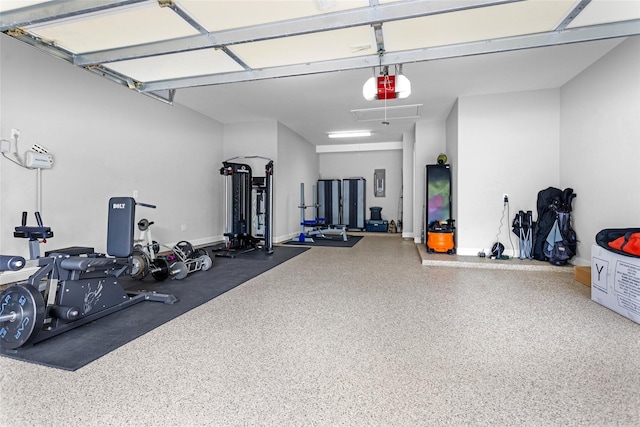 7 Woodglade Way, Tomball, TX 77375 - garage featuring electric panel and a garage door opener