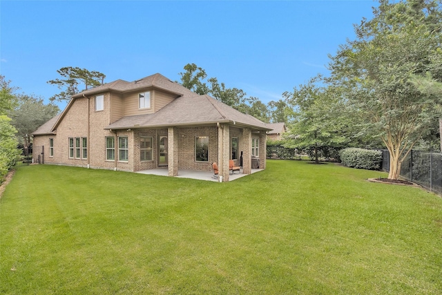 7 Woodglade Way, Tomball, TX 77375 - back of house featuring brick siding, a patio, and roof with shingles