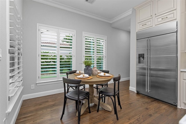 7 Woodglade Way, Tomball, TX 77375 - dining room with ornamental molding, dark wood finished floors, and baseboards