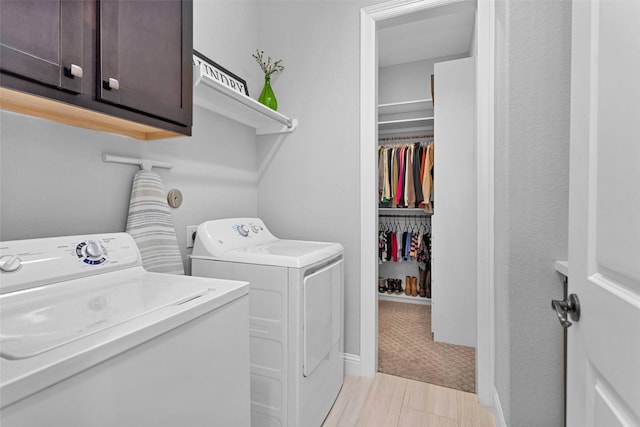 7 Woodglade Way, Tomball, TX 77375 - laundry room featuring washing machine and clothes dryer and cabinet space