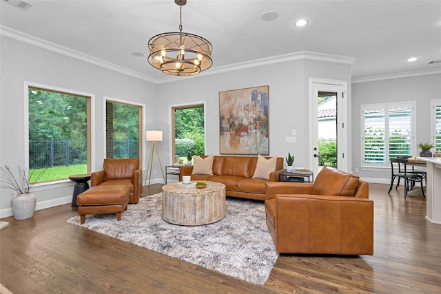 7 Woodglade Way, Tomball, TX 77375 - living room featuring wood finished floors, a chandelier, recessed lighting, baseboards, and ornamental molding