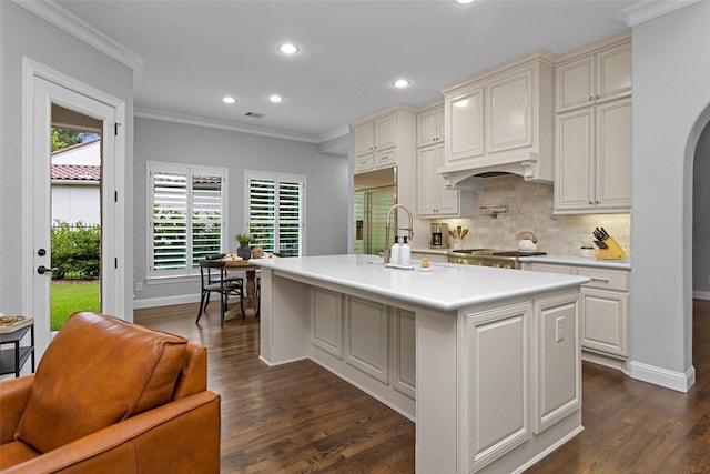 7 Woodglade Way, Tomball, TX 77375 - kitchen featuring recessed lighting, dark wood finished floors, decorative backsplash, ornamental molding, and light countertops