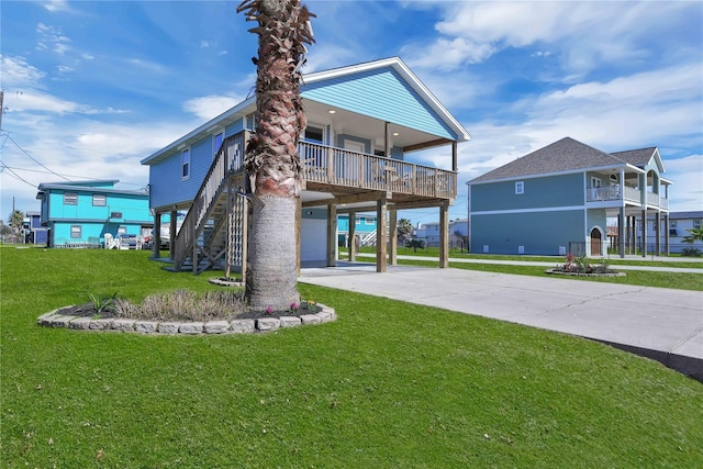 4023 Grayson Dr, Galveston, TX 77554 - rear view of house featuring a carport, concrete driveway, and a lawn