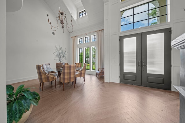 23323 Two Harbors Glen St, Katy, TX 77494 - entryway with high vaulted ceiling, french doors, and a chandelier