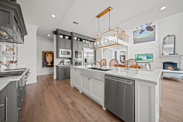 23323 Two Harbors Glen St, Katy, TX 77494 - kitchen featuring built in appliances, gray cabinetry, a sink, light stone counters, and recessed lighting