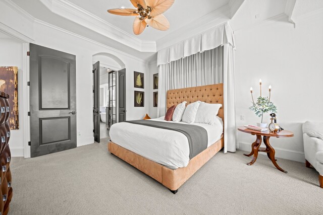 23323 Two Harbors Glen St, Katy, TX 77494 - bedroom with light colored carpet, crown molding, arched walkways, baseboards, and a ceiling fan