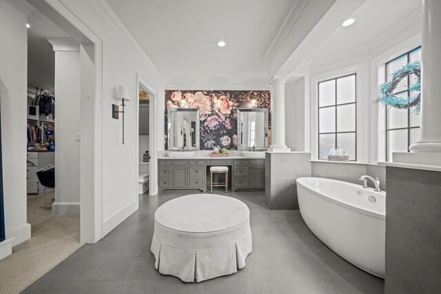 23323 Two Harbors Glen St, Katy, TX 77494 - full bath featuring ornate columns, healthy amount of natural light, vanity, a freestanding tub, and ornamental molding