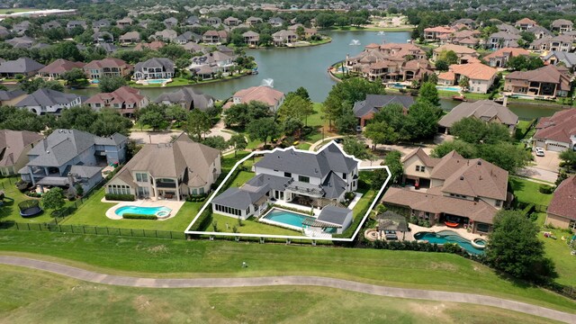 23323 Two Harbors Glen St, Katy, TX 77494 - aerial perspective of suburban area with property parcel outlined, a pool, and a large body of water