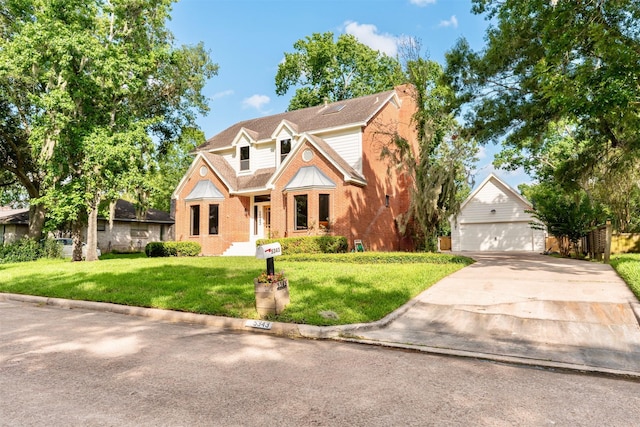 5343 Appleblossom Ln, Friendswood, TX 77546 - traditional home featuring an outbuilding, a front yard, brick siding, and a chimney