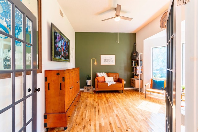 5343 Appleblossom Ln, Friendswood, TX 77546 - living area with light wood-style flooring and ceiling fan