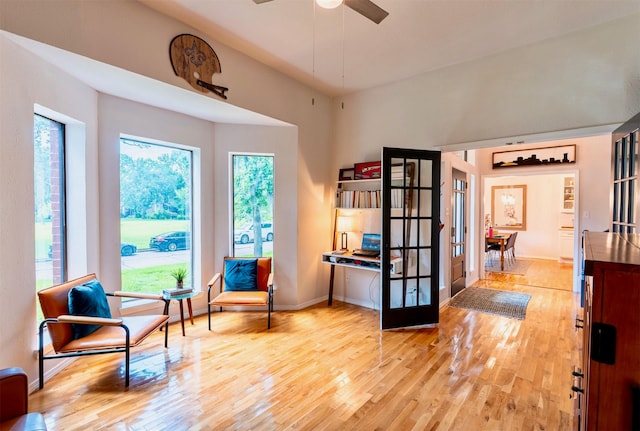5343 Appleblossom Ln, Friendswood, TX 77546 - sitting room with french doors, light wood-type flooring, and ceiling fan