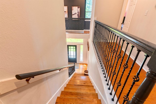 5343 Appleblossom Ln, Friendswood, TX 77546 - stairs with wood finished floors and a towering ceiling