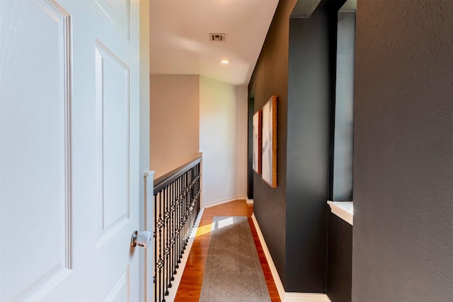5343 Appleblossom Ln, Friendswood, TX 77546 - corridor with wood finished floors, an upstairs landing, and recessed lighting