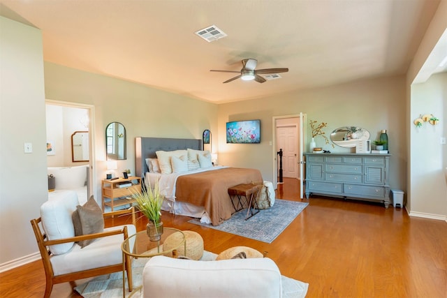 5343 Appleblossom Ln, Friendswood, TX 77546 - bedroom featuring wood finished floors, ensuite bath, and ceiling fan