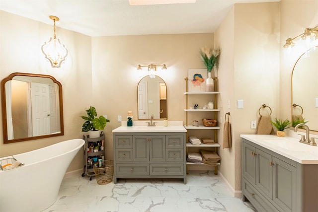 5343 Appleblossom Ln, Friendswood, TX 77546 - full bathroom with two vanities, marble finish flooring, and a soaking tub