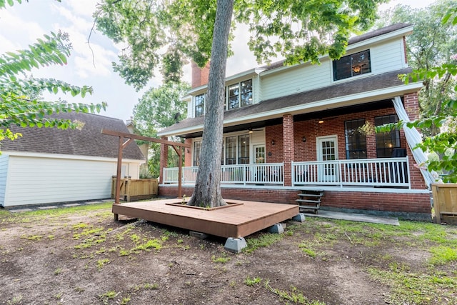 5343 Appleblossom Ln, Friendswood, TX 77546 - rear view of house featuring brick siding, a deck, and a chimney