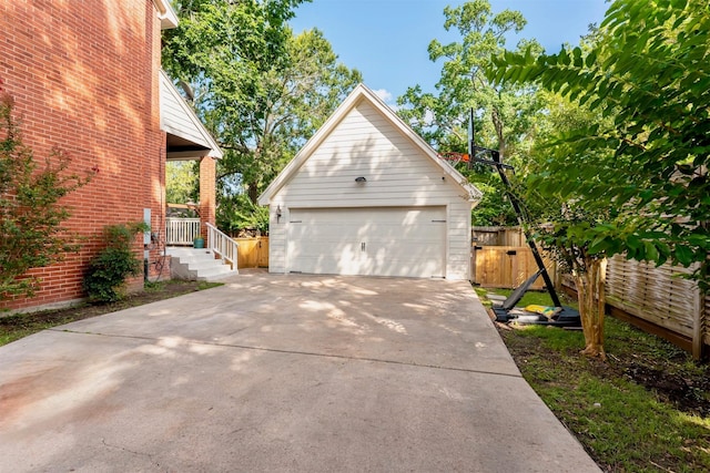 5343 Appleblossom Ln, Friendswood, TX 77546 - view of home's exterior with a detached garage and brick siding