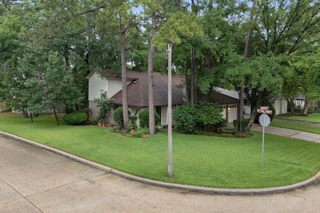 71 Timberspire Ln, The Woodlands, TX 77380 - view of front of home with a front yard and a garage