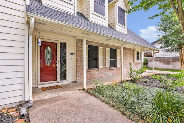 20131 Magnolia Bend Dr, Humble, TX 77346 - entrance to property with a porch, brick siding, and a shingled roof