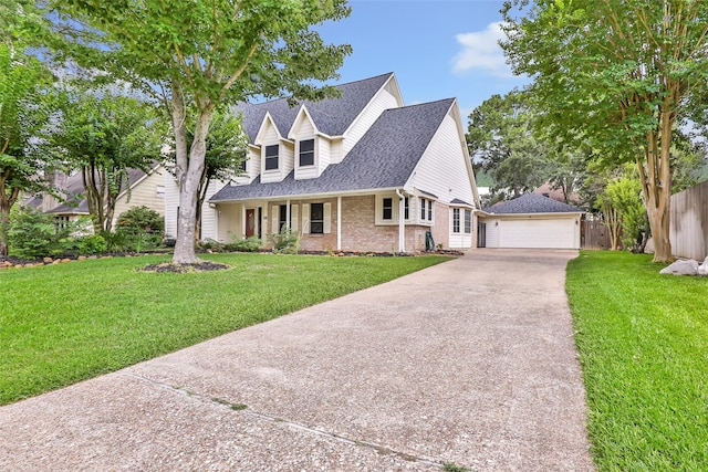 20131 Magnolia Bend Dr, Humble, TX 77346 - view of front facade with brick siding, a detached garage, an outdoor structure, and roof with shingles