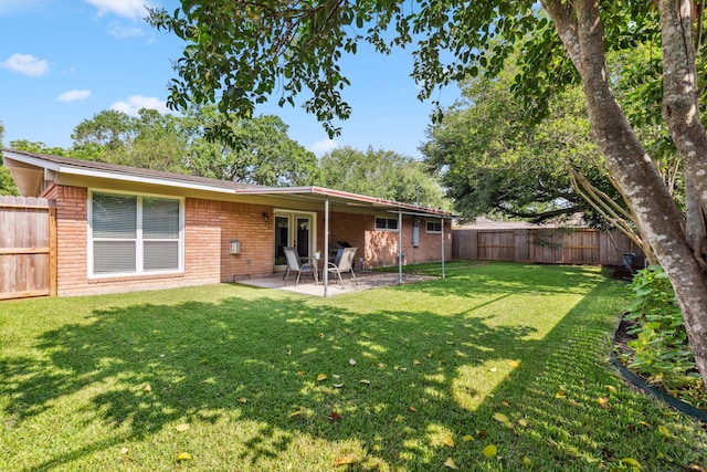 9123 Kapri Ln, Houston, TX 77025 - rear view of house featuring brick siding, a patio, and french doors