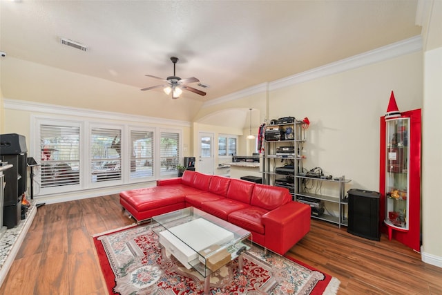 20107 Black Canyon Dr, Katy, TX 77450 - living room featuring ceiling fan, ornamental molding, wood finished floors, arched walkways, and vaulted ceiling