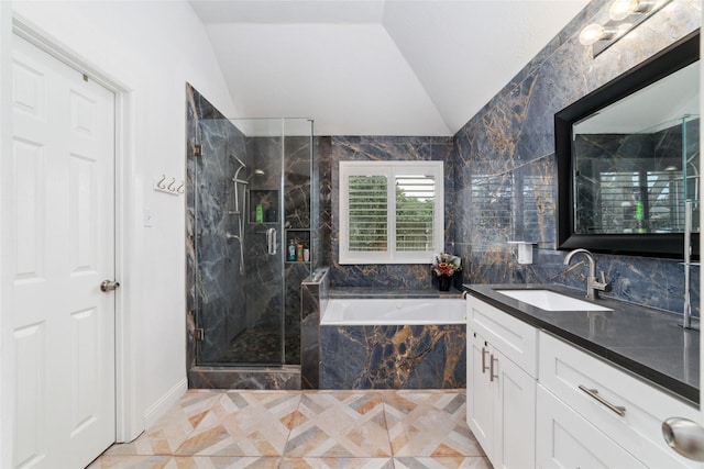 20107 Black Canyon Dr, Katy, TX 77450 - bathroom with vaulted ceiling, vanity, a bath, and a marble finish shower