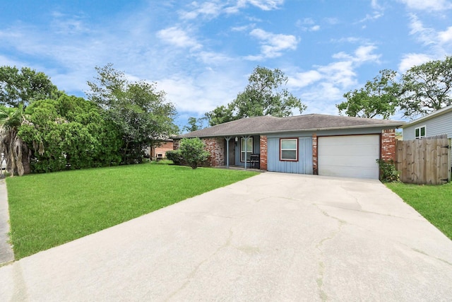 5423 Lillian St, Baytown, TX 77521 - ranch-style house with a garage, driveway, covered porch, and brick siding