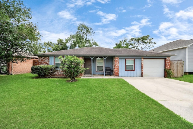 5423 Lillian St, Baytown, TX 77521 - ranch-style home with a garage and driveway