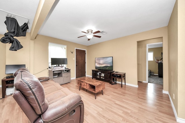 5423 Lillian St, Baytown, TX 77521 - living room with a ceiling fan, plenty of natural light, and light wood-style flooring