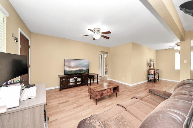 5423 Lillian St, Baytown, TX 77521 - living area featuring a ceiling fan, light wood-type flooring, and baseboards