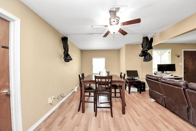 5423 Lillian St, Baytown, TX 77521 - dining area featuring light wood-style floors, healthy amount of natural light, and a ceiling fan
