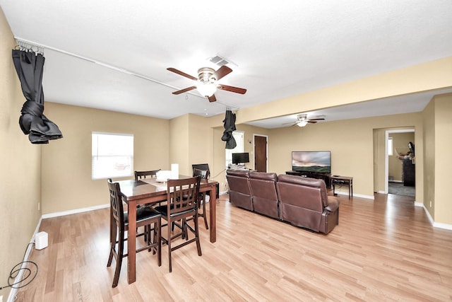 5423 Lillian St, Baytown, TX 77521 - dining area featuring a ceiling fan, light wood-type flooring, and baseboards