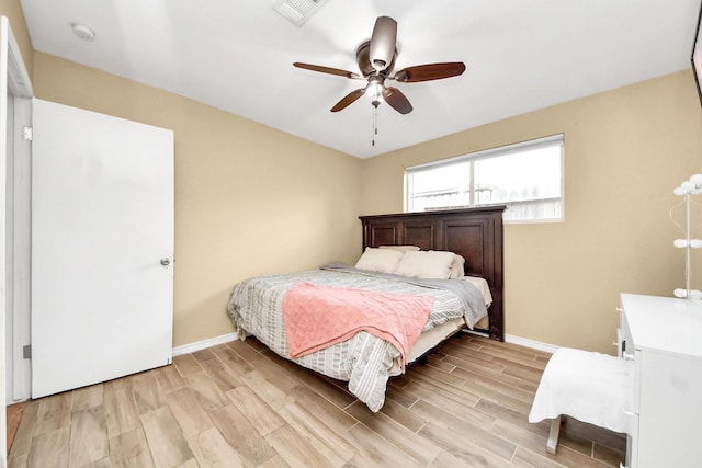 5423 Lillian St, Baytown, TX 77521 - bedroom featuring baseboards, light wood-style flooring, and a ceiling fan