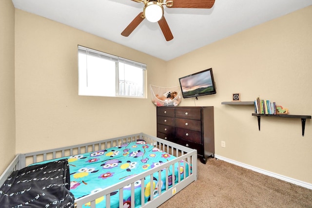 5423 Lillian St, Baytown, TX 77521 - bedroom featuring carpet floors, baseboards, and a ceiling fan