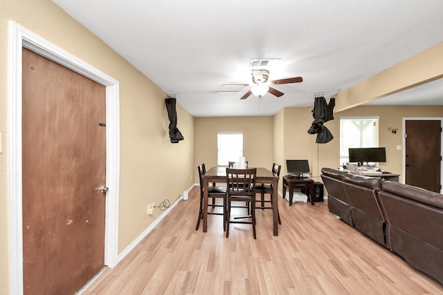 5423 Lillian St, Baytown, TX 77521 - dining space with light wood-style flooring, ceiling fan, and baseboards