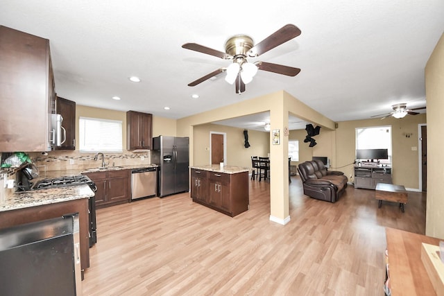 5423 Lillian St, Baytown, TX 77521 - kitchen with stainless steel appliances, ceiling fan, a sink, open floor plan, and recessed lighting