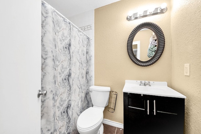 5423 Lillian St, Baytown, TX 77521 - bathroom featuring vanity, toilet, tile patterned floors, a textured wall, and curtained shower